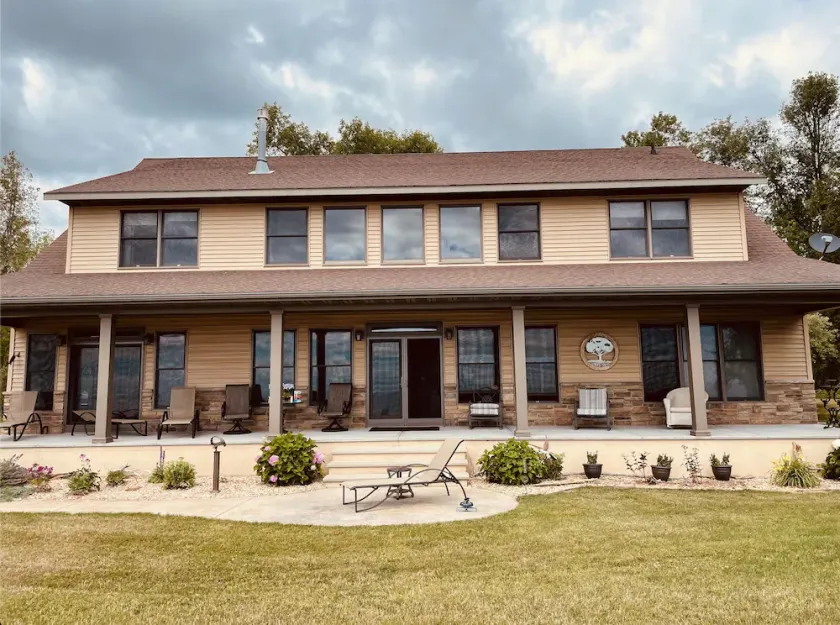 Private lakefront home with 1,200 feet of sandy beach. A year-round retreat. - Image 1