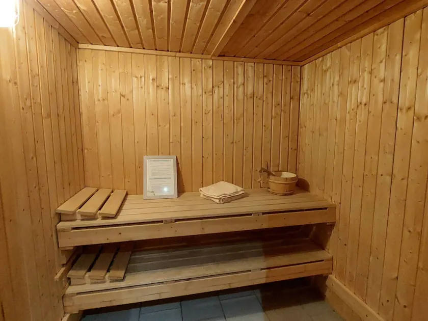 Rustic Holiday Home with Sauna & Hot Tub in Wooded Area - Image 1