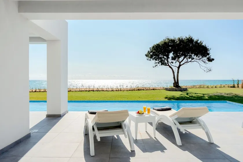 Seafront Villa Nafsika - Private Heated infinity Pool - Direct access to the beach - Play area - Image 1