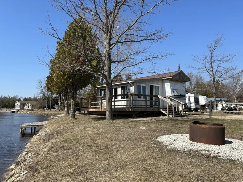 #0 Enjoy a waterfront view from your own trailer with a deck & sunroom - Image 1