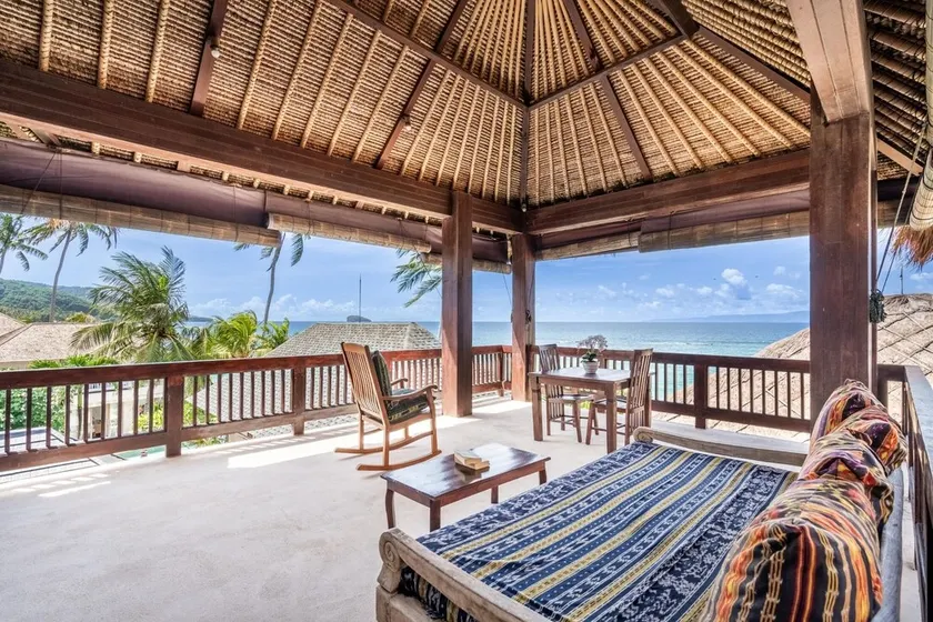 Deluxe Room with Balcony and Ocean View | The Village of Angels Resort - Image 1