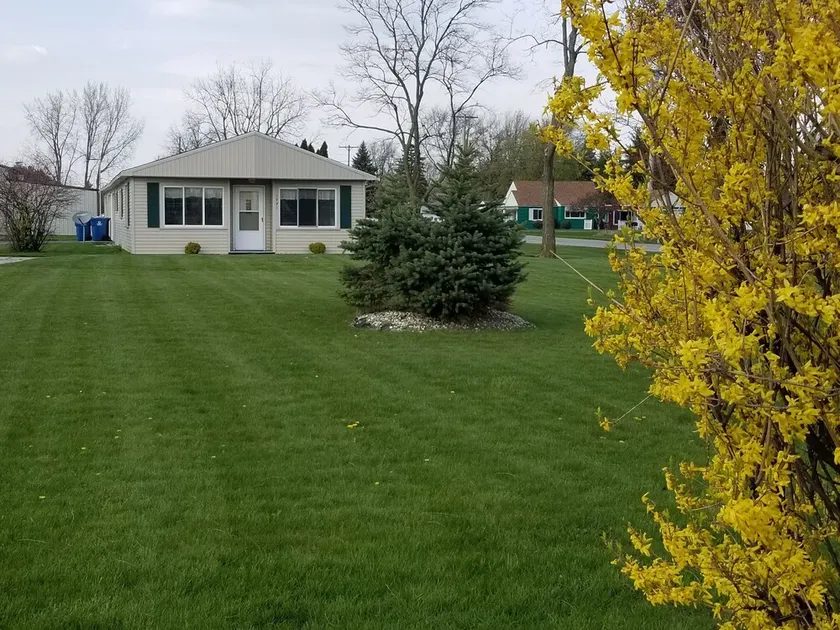 Open concept 2 bedroom ranch with attached garage and deck - Image 1