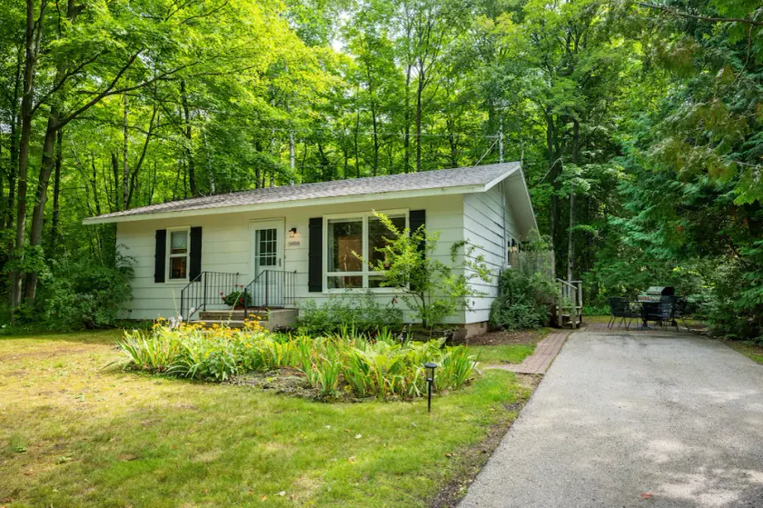 Retreat on a wooded lot within walking distance of downtown! - Image 1