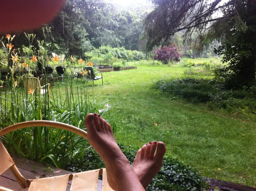 You're in a hot tub; you see gardens and hear wind blowing through the pines. - Image 1