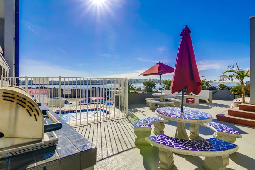 View of the water, steps from the beach, bikes and other toys included. - Image 1