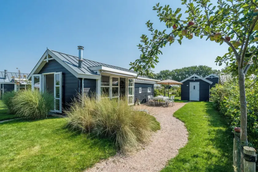 This chalet has an extra spacious living room and two sitting areas, one of which is situated by the - Image 1
