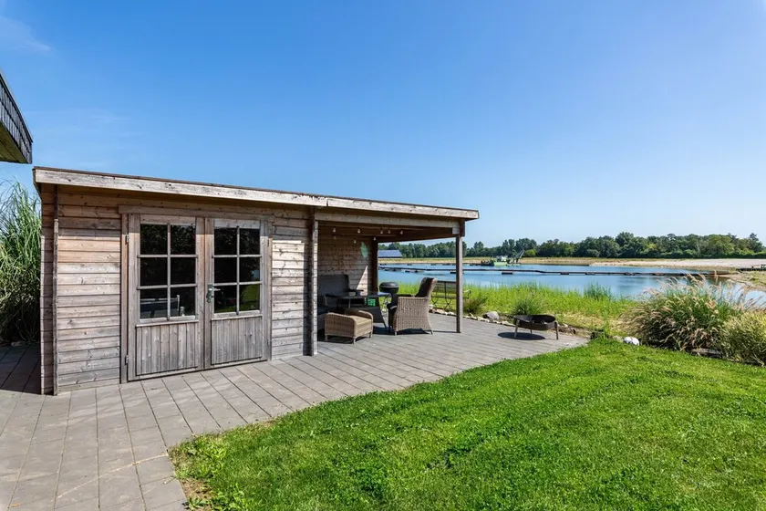 Casa vacanze 'Ferienhaus Am See' con vista sul lago, terrazza privata e Wi-Fi - Image 1