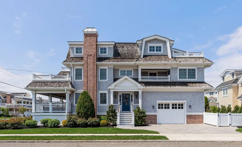 Spacious deck has ocean views as home is across the street from the beachblock. - Image 1