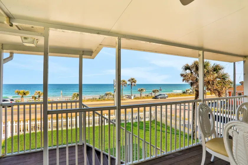 Updated home across from beach with covered balcony, central AC, & washer/dryer - Image 1