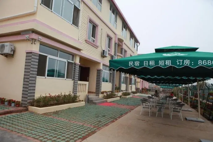 Qingdao Home Holiday Hotel - Image 1