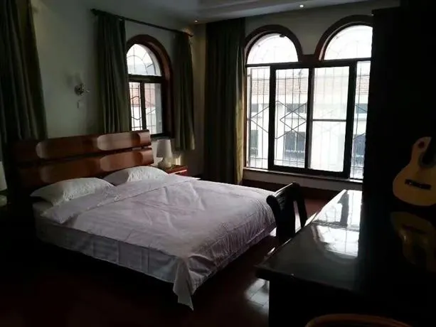 QINGDAO ONE YARD INN - Image 1