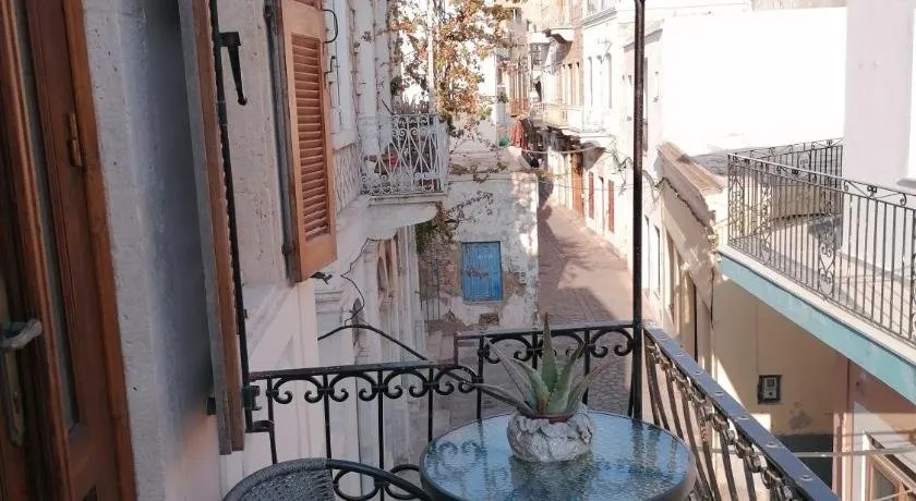 THEOS APARTMENTS - Image 1