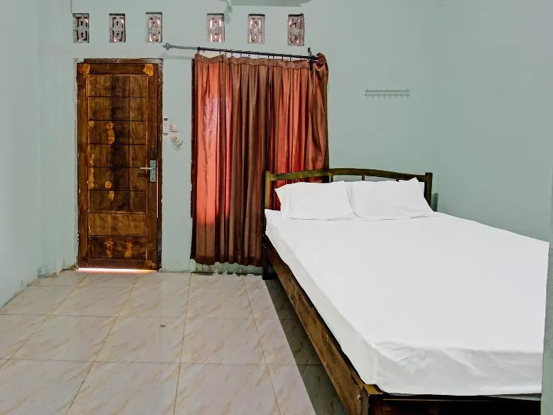 SPOT ON 91771 Homestay Bang Haji - Image 1
