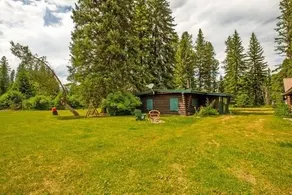 Rustic 1950's Cozy Creekside Log Cabin on 10 Acres - Image 5