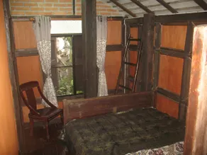 teak house in a topical garden - Image 2