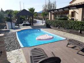 A rural house with a swimming pool and surrounded by nature - Image 4