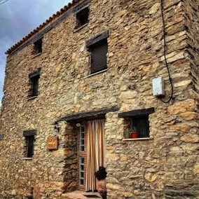 Rustic house with patio and indoor fireplace - Image 2