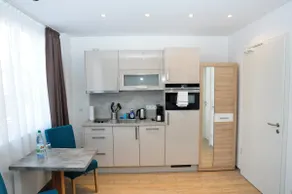 Modern one-room apartment with two single beds - Image 4