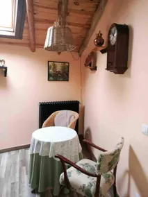 Rustic house with patio and indoor fireplace - Image 5