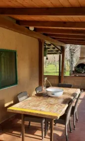 Chalet with fireplace surrounded by woods. - Image 2