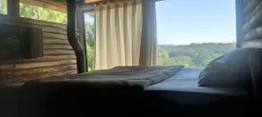 Rustic log cabin with heated bathtub. - Image 4