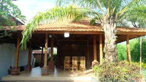 Pujis Homestay with a private pool and garden view - Image 4