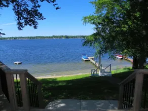 155 ft of Beachfront home on Paw Paw Lake - Image 2