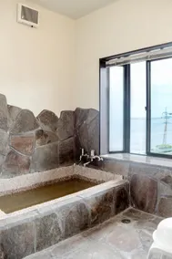 OCEAN STAY HAKUTO: A building with a tiled roof and a vibrant orange color against the backdrop of the ocean and sky will welcome you - Image 4