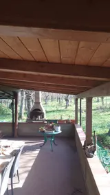 Chalet with fireplace surrounded by woods. - Image 5