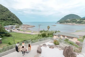 OCEAN STAY HAKUTO: A building with a tiled roof and a vibrant orange color against the backdrop of the ocean and sky will welcome you - Image 3