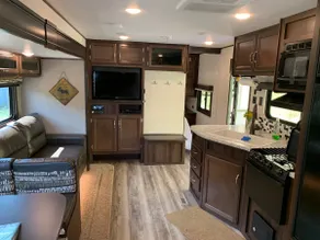 Into the Woods 32’ Camper with Slide-Out, Hot Tub - Image 4