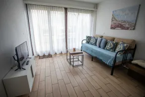 Lakefront apartment with beach and pool - Image 2