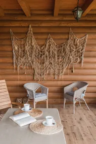 An atmospheric log house surrounded by forest - Image 2