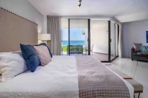 A condominium in front of the pool and beach - Image 2