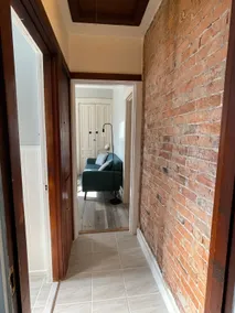 Historic Red Brick Home with Patio & Full Kitchen - Image 5