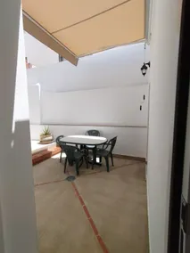 Apartamentos de Dora, House with a double bed and a sofa. - Image 3