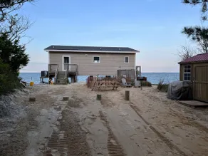 Modern Beachfront Cottage with Endless Bay Views - Image 3