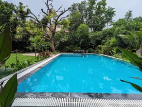 Nature’s Trail: Quiet 2BHK + Peaceful Pool Time - Image 3