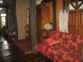 teak house in a topical garden - Image 3