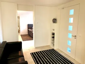 Luxurious hotel room surrounded by greenery - Image 3