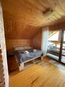 Cabin house surrounded by deers and forest - Image 5