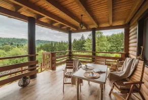 An atmospheric log house surrounded by forest - Image 3