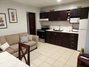 Apartment surrounded by beautiful gardens and a pool - Image 5
