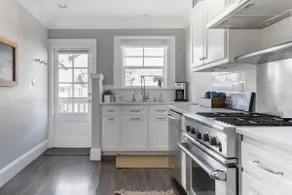 City Haven Apartment with a Fireplace in a Craftsman House - Image 5