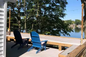 Beautiful 1BR lake cottage, fenced prop, pet safe. Swimming beach next to home. - Image 2
