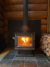 A cozy, romantic lake view log cabin with hot tub & wood burning fireplace. - Image 4