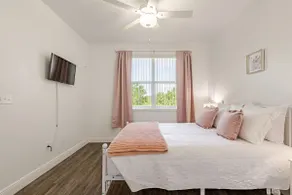 Chic Pink 2BR | Pool · Patio · Gym · Free Parking - Image 5