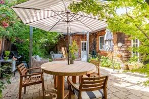 Soak up the Serenity on the Patio of a Charming Cottage - Image 3