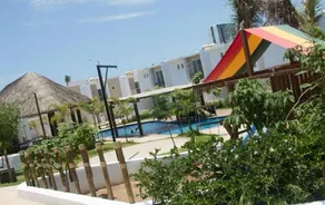 House near the beach in a private community with a pool - Image 2