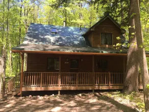 CABIN IN THE WOODS NESTLED ON 15 WOODED ACRES. - Image 2